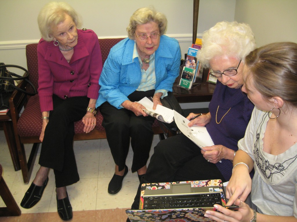 UA student talking to group of elderly women