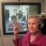 elderly woman wearing headphones
