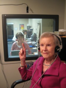 elderly woman wearing headphones
