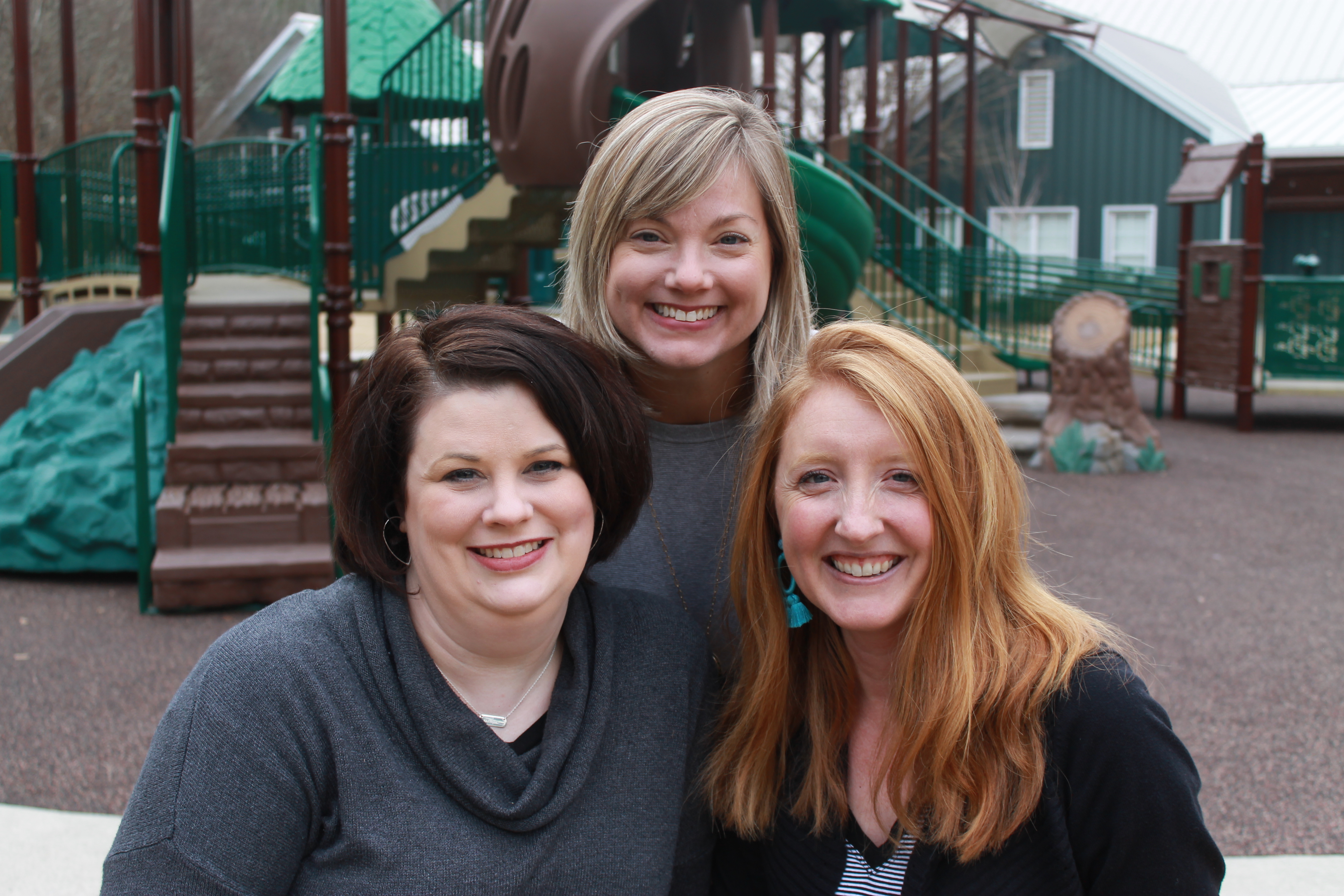 Lynn Roebuck, Meredith Hankins, and Melissa Pouncey outside at a playground