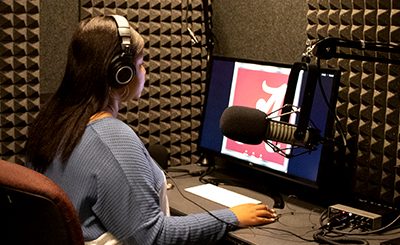 UA communicative disorders major conducting research in a sound booth